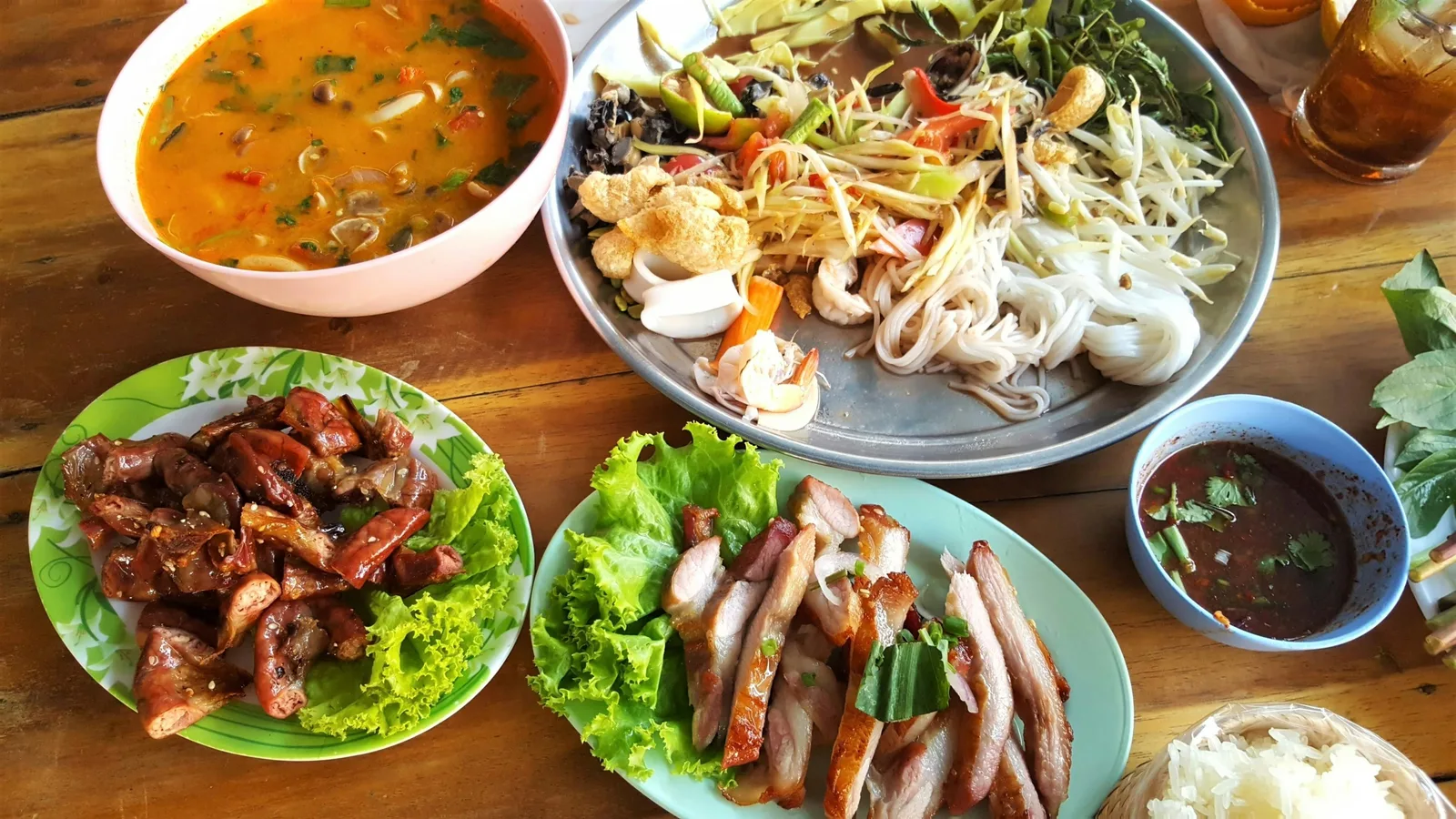 Phuket cheap eats plates including moo hong and o-tao at a local street food stall