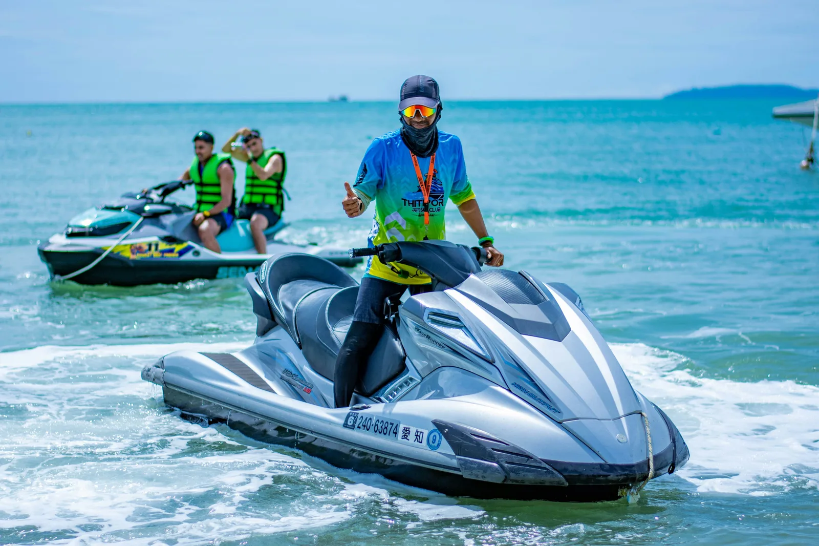 Jet ski Phuket: a rider speeding across the Andaman Sea off Patong Beach