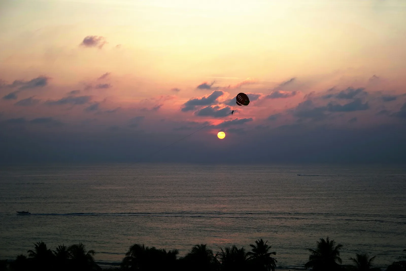 Parasailing over Patong Bay near the Phuket jet ski beaches