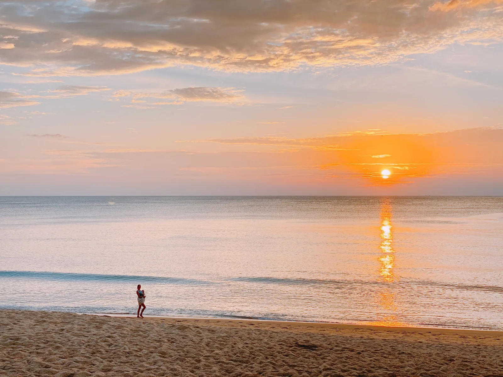 Couple watching a Phuket sunset, a classic romantic thing to do in Phuket