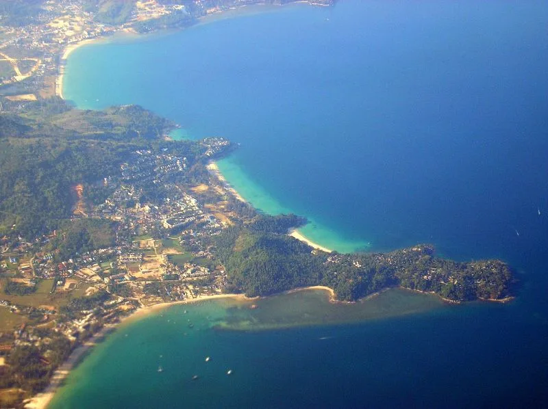 Surin Beach Phuket, 1.2 km crescent of white-gold sand and turquoise Andaman Sea at golden hour