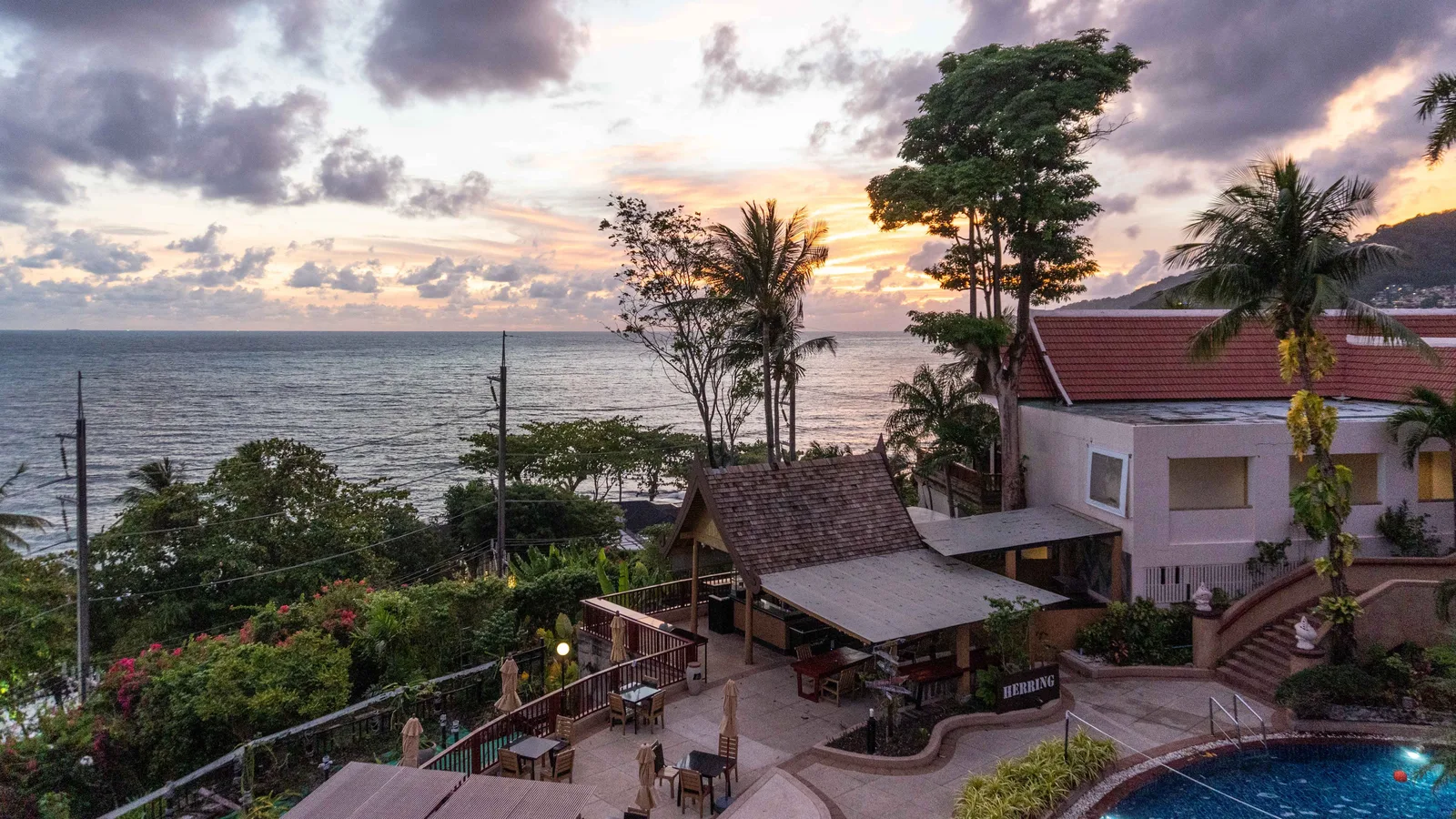 Where to stay Phuket first time: aerial view of a west-coast Phuket beach lined with resorts